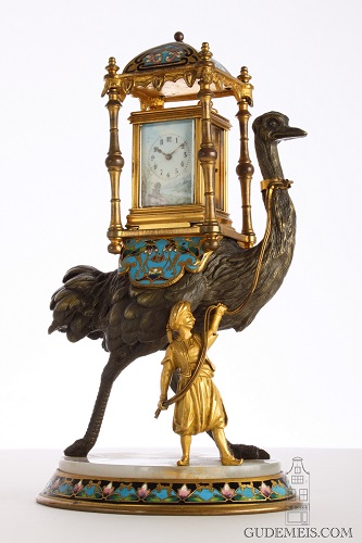 a French miniature porcelain mounted carriage clock on sculptural stand, circa 1880.